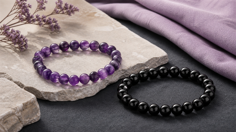 Amethyst bracelet and black obsidian bracelet styled together for comparison