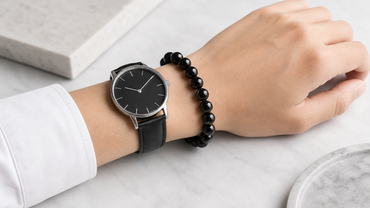 Black obsidian bracelet worn with a simple black watch