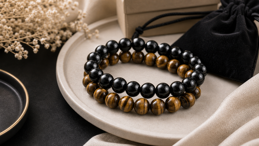 Black obsidian and tiger eye bracelet set styled for everyday stacking