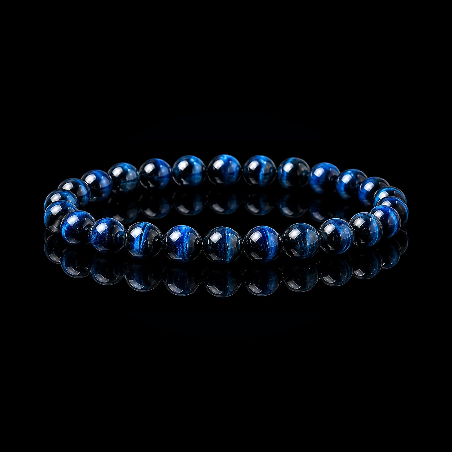 Blue Tiger Eye stretch bracelet with polished deep blue-black beads on black