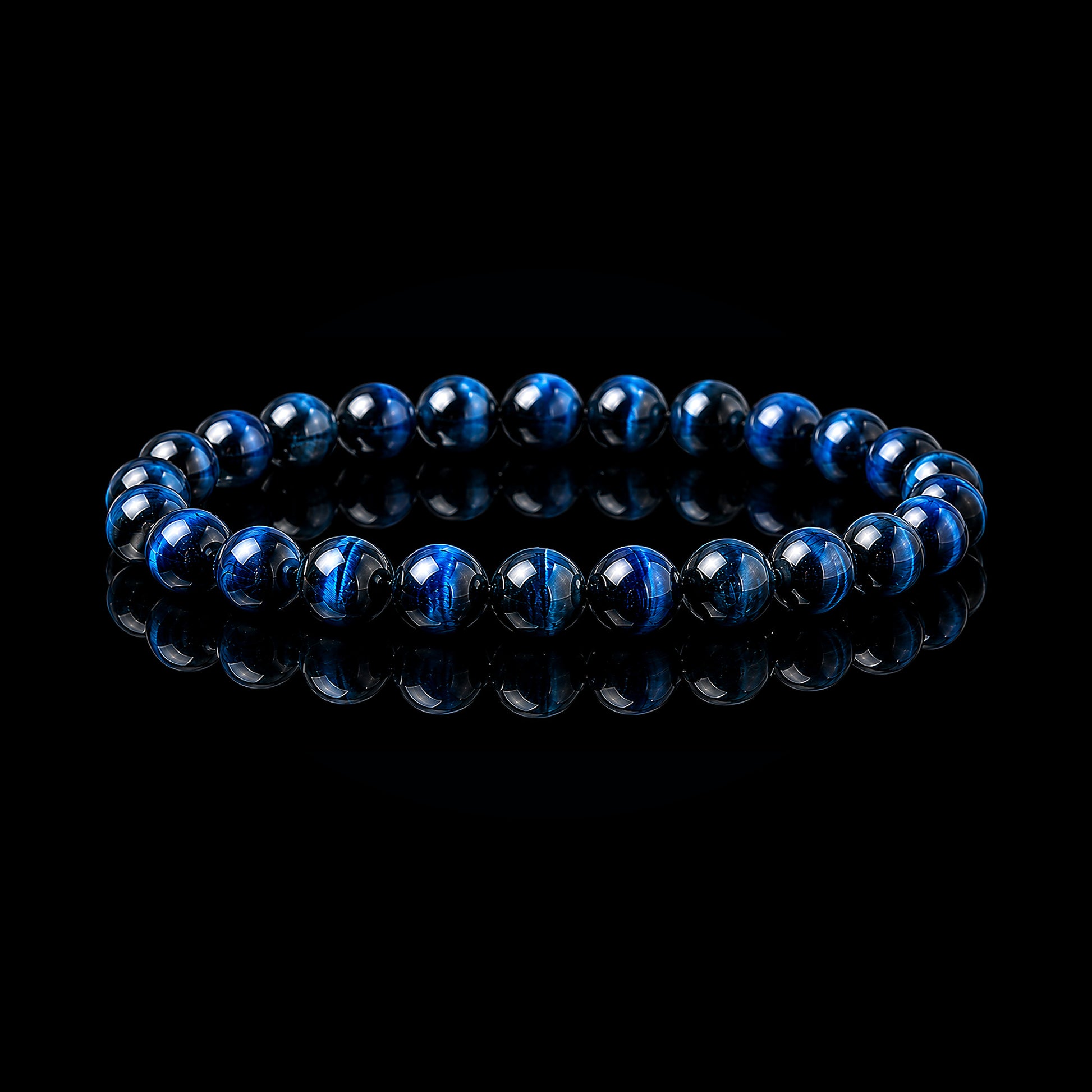 Blue Tiger Eye stretch bracelet with polished deep blue-black beads on black