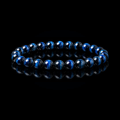 Blue Tiger Eye stretch bracelet with polished deep blue-black beads on black