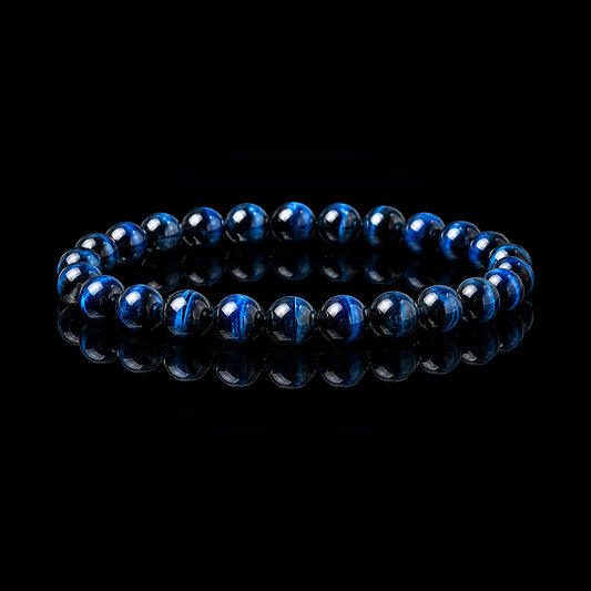 Blue Tiger Eye stretch bracelet with polished deep blue-black beads on black