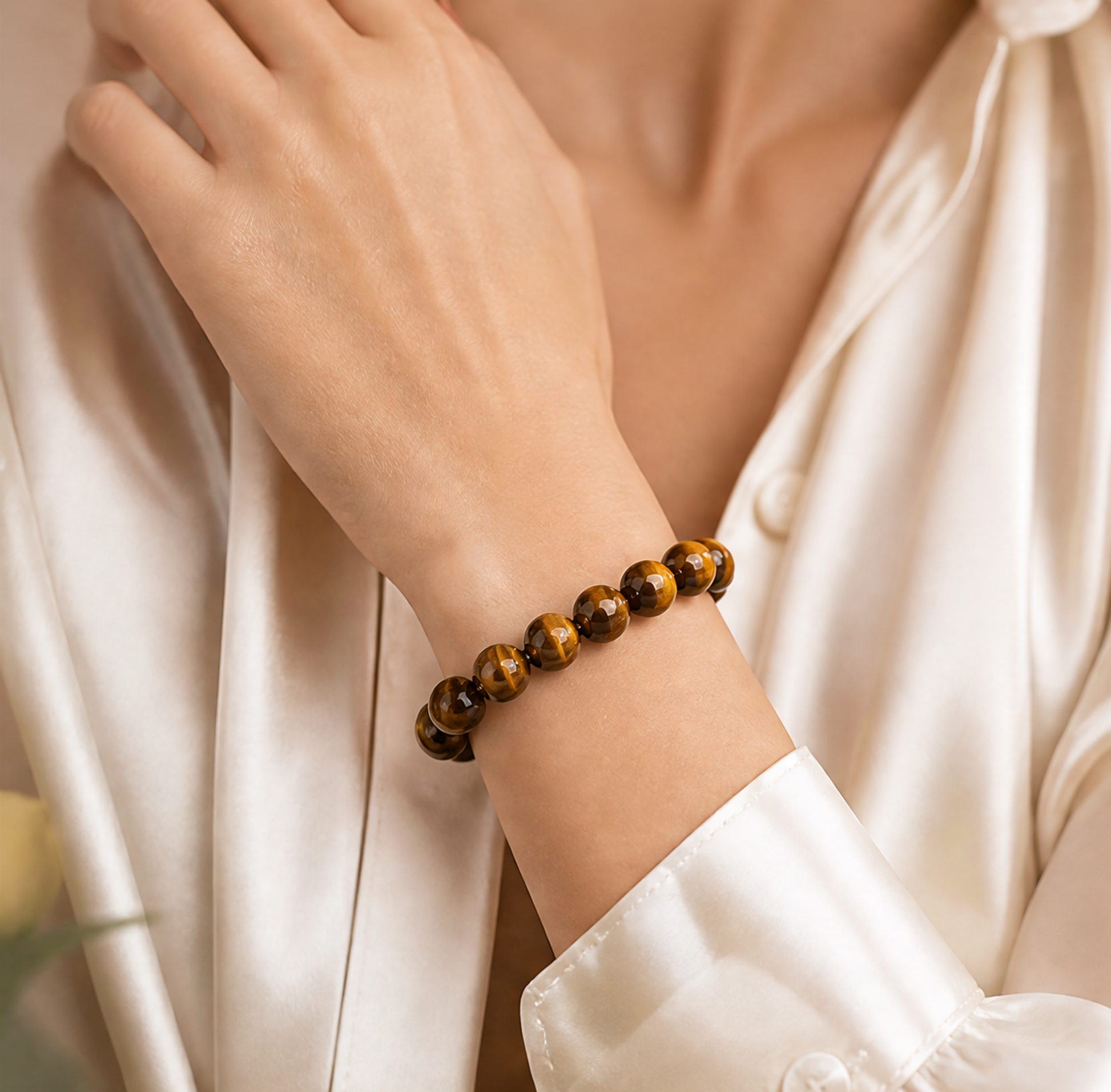 Golden Tiger Eye Bracelet worn on wrist with white shirt